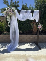 IMG 7358202 1755023375 Arch with draping and faux flowers